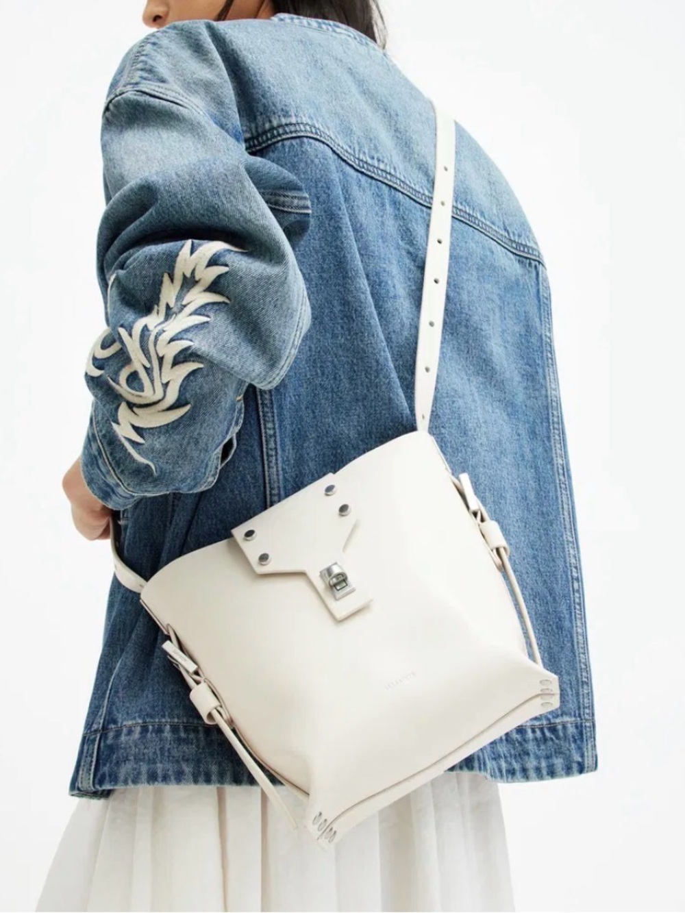 AllSaints Miro Turn Lock Leather Crossbody Bag Cream Silver Bucket Womens